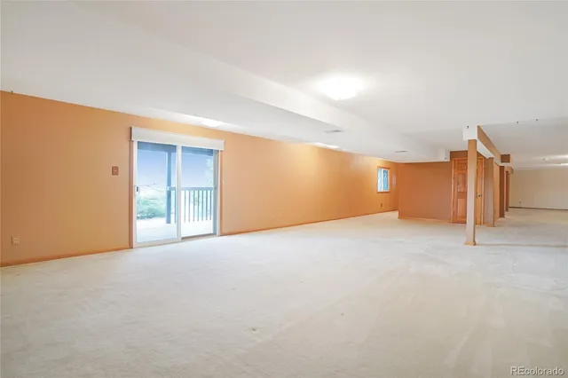 an empty room with a mirror