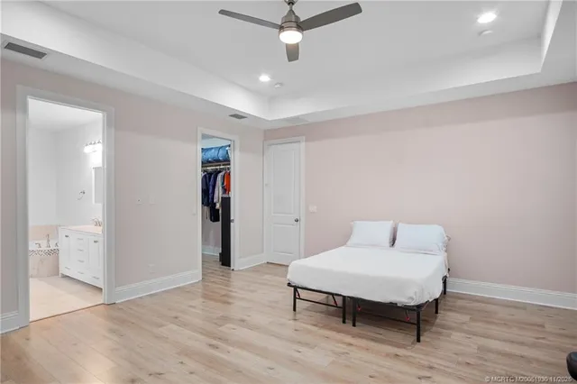 a living room with furniture a window and a wooden floor