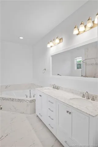 a bathroom with a toilet a sink and a bathtub