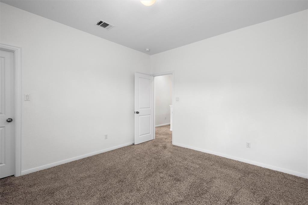 236 Prato Place Georgetown, TX 78628 - Photo 37 of 40 Comfortable carpeting graces this well-lit room, ready for your personal touch.