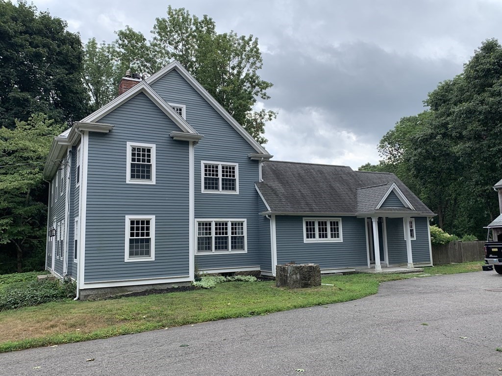 1481 Bay Road Sharon, MA 02067 - Photo 2 of 29 a front view of a house with a garden