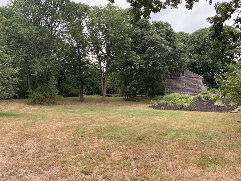 1481 Bay Road Sharon, MA 02067 - Photo 8 of 29 a backyard of a house with lots of green space