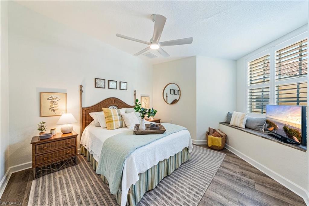 20280 Burnside Place, Unit 1202 Estero, FL 33928 - Photo 14 of 42 a bedroom with bed and a window