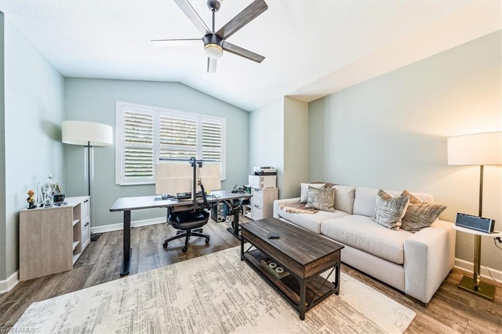 20280 Burnside Place, Unit 1202 Estero, FL 33928 - Photo 16 of 42 a living room with furniture and a large window