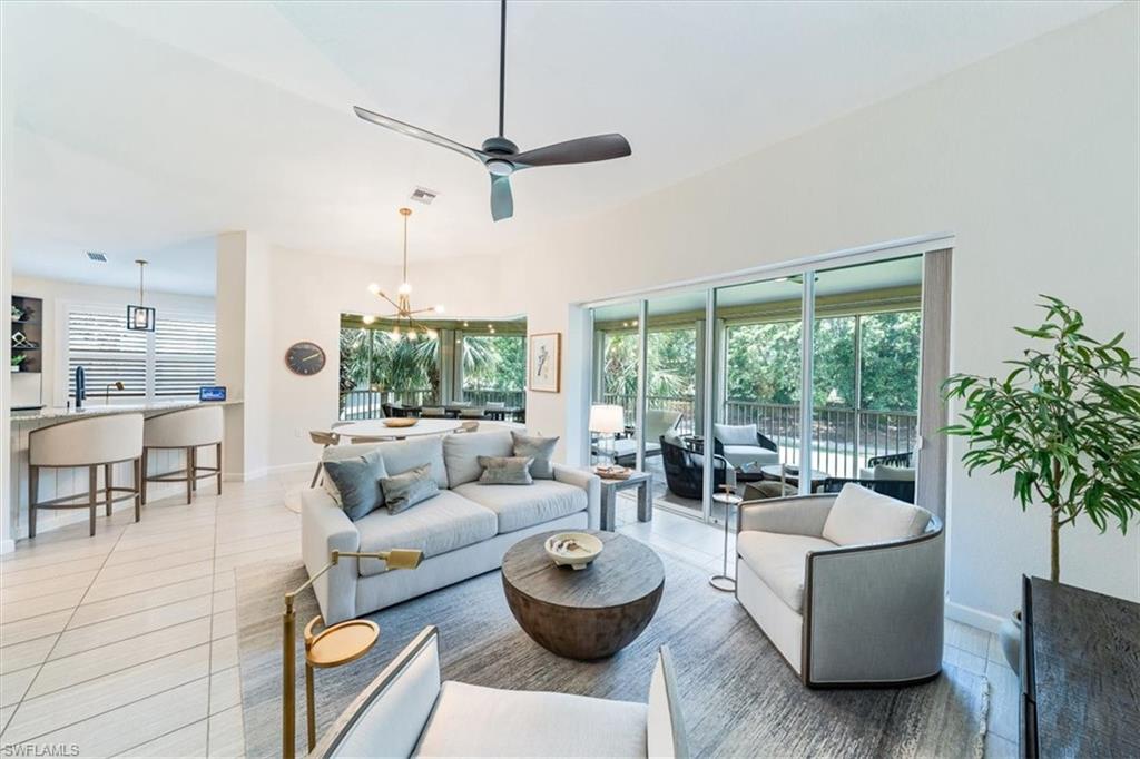 20280 Burnside Place, Unit 1202 Estero, FL 33928 - Photo 22 of 42 a living room with furniture and a large window