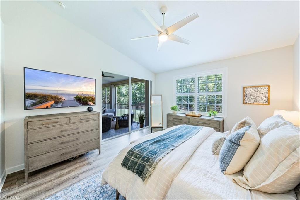 20280 Burnside Place, Unit 1202 Estero, FL 33928 - Photo 24 of 42 a bedroom with a bed and a large window
