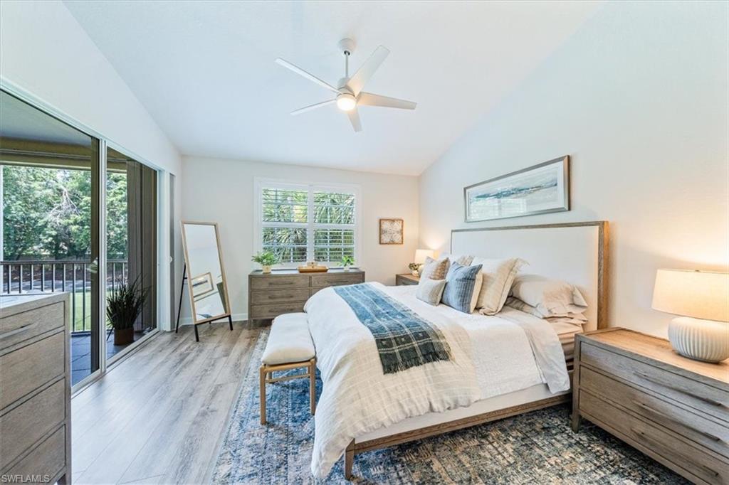 20280 Burnside Place, Unit 1202 Estero, FL 33928 - Photo 25 of 42 a bedroom with a large bed and a large window