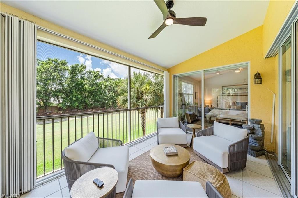 20280 Burnside Place, Unit 1202 Estero, FL 33928 - Photo 27 of 42 a living room with furniture and a large window