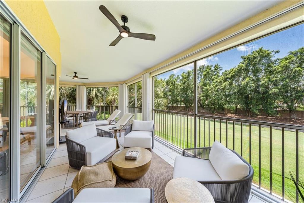 20280 Burnside Place, Unit 1202 Estero, FL 33928 - Photo 28 of 42 a living room with furniture and a large window
