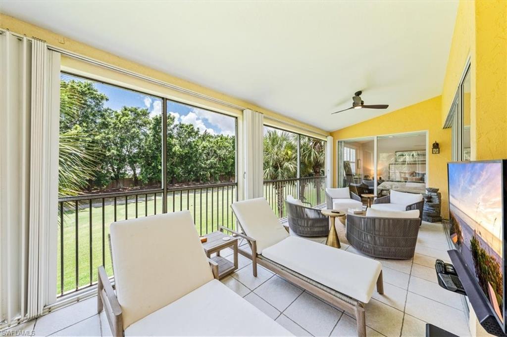 20280 Burnside Place, Unit 1202 Estero, FL 33928 - Photo 29 of 42 a living room with furniture and a large window