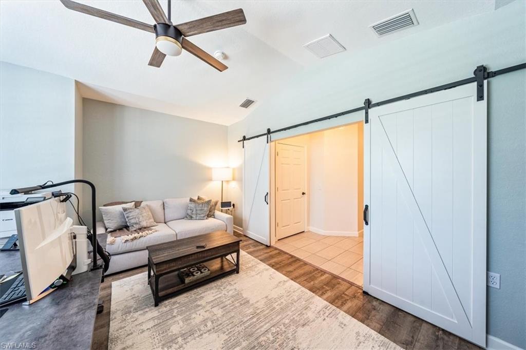 20280 Burnside Place, Unit 1202 Estero, FL 33928 - Photo 36 of 42 a bedroom with furniture and a window