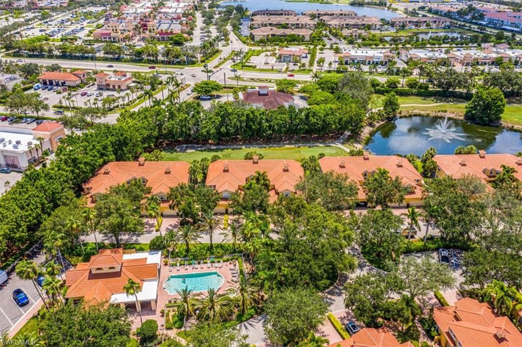20280 Burnside Place, Unit 1202 Estero, FL 33928 - Photo 38 of 42 an aerial view of residential houses with outdoor space and swimming pool