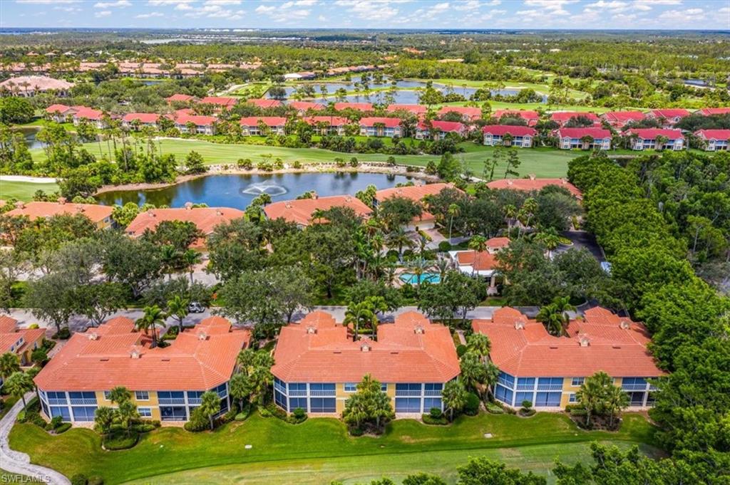 20280 Burnside Place, Unit 1202 Estero, FL 33928 - Photo 39 of 42 a view of a bunch of houses with yard