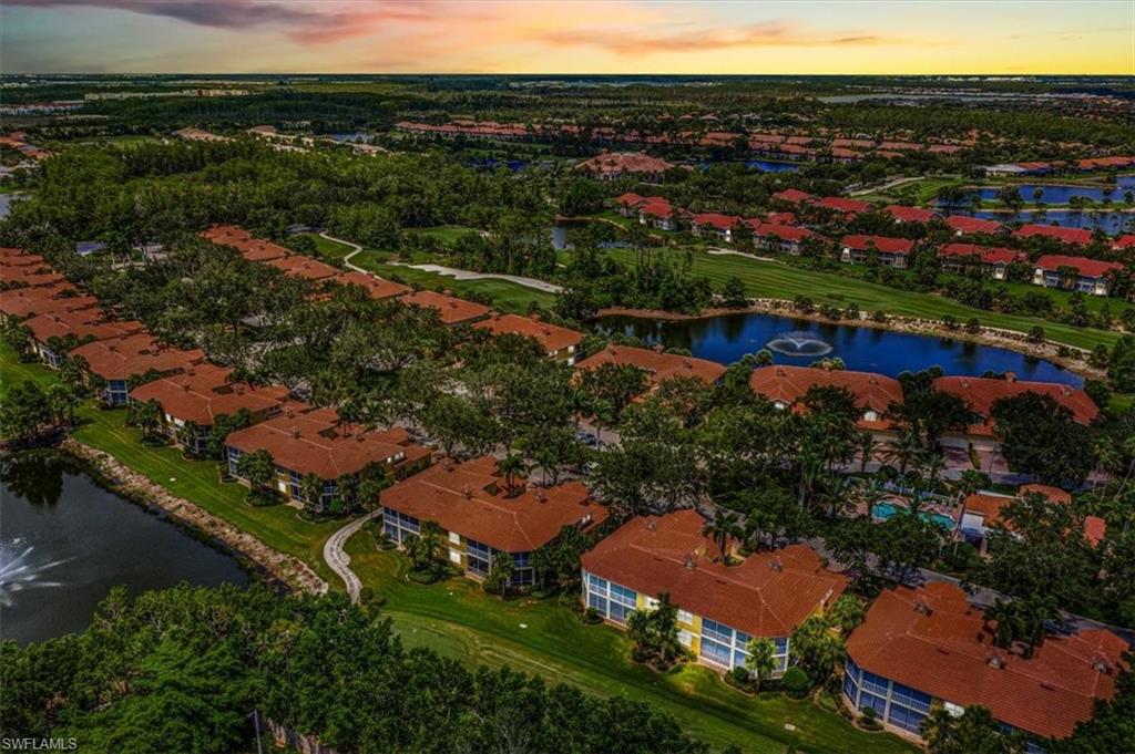 20280 Burnside Place, Unit 1202 Estero, FL 33928 - Photo 40 of 42 an aerial view of residential houses and outdoor space