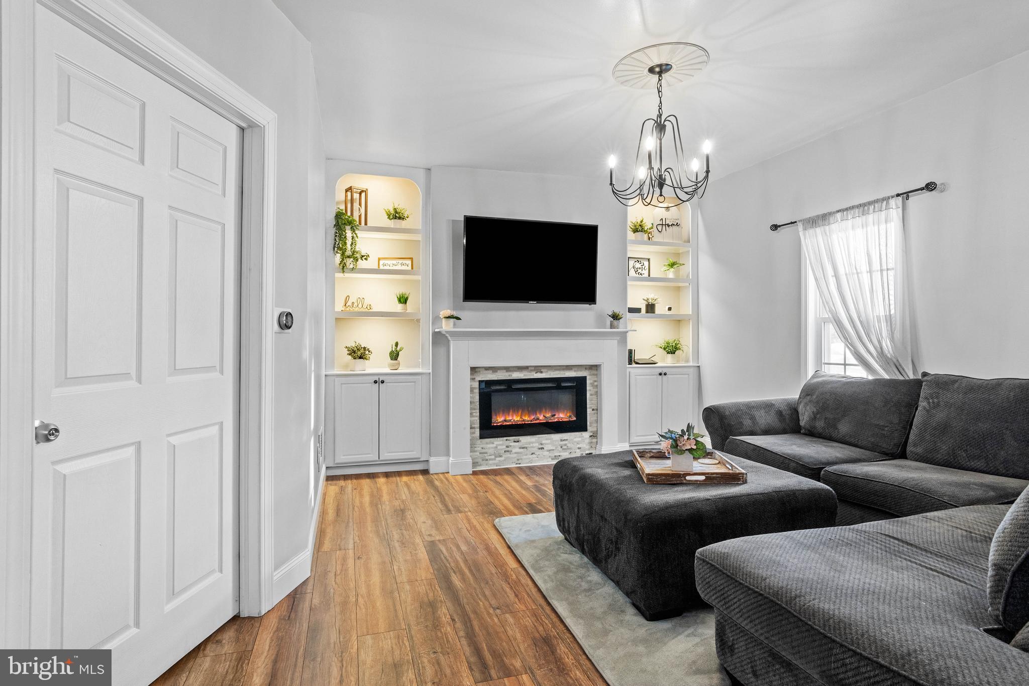 197 Ridge Street Smokerun, PA 16681 - Photo 14 of 47 a living room with furniture a flat screen tv and a fireplace