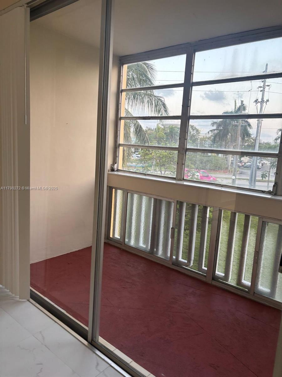 Ojus Miami, FL 33179 - Photo 12 of 15 an empty room with wooden floor