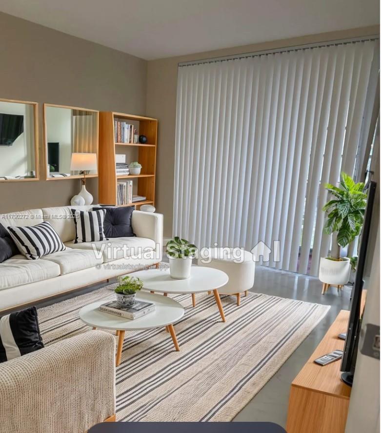 Ojus Miami, FL 33179 - Photo 2 of 15 a living room with furniture and a potted plant