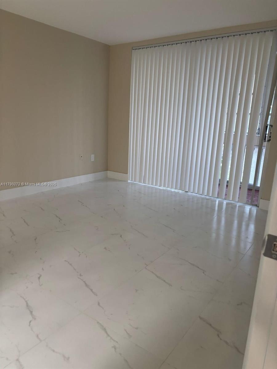 Ojus Miami, FL 33179 - Photo 9 of 15 a view of a room with a wooden floor