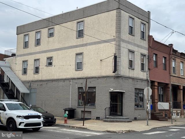 a view of a car parked in front of a building