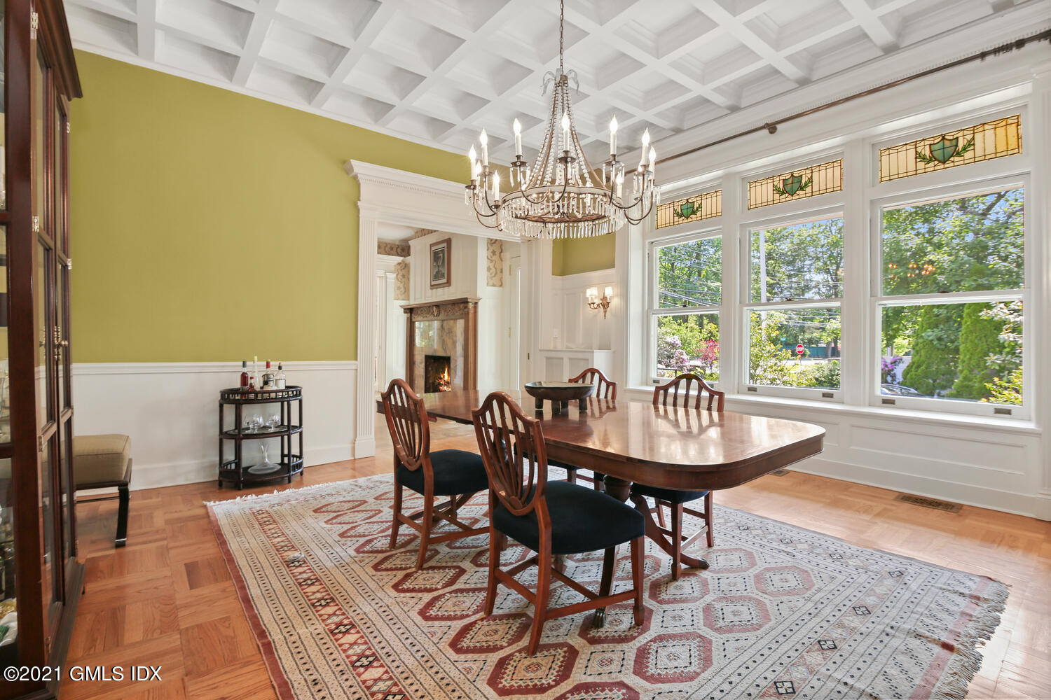 1 North Street Greenwich, CT 06830 - Photo 11 of 36 a view of a dining room with furniture a chandelier and wooden floor