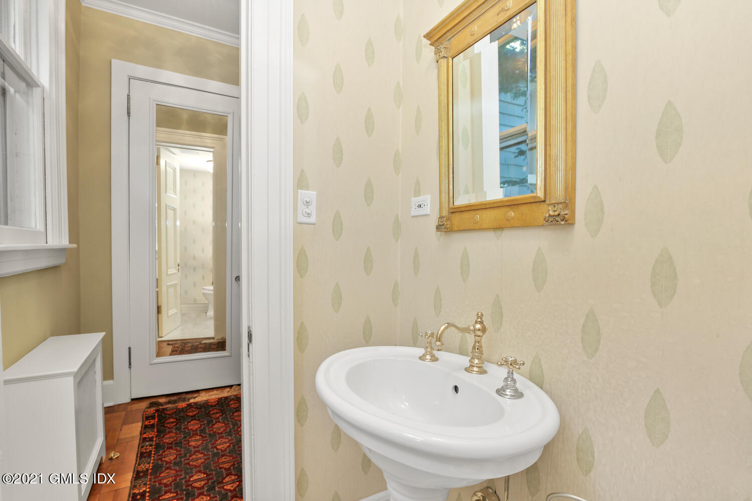 1 North Street Greenwich, CT 06830 - Photo 22 of 36 a bathroom with a sink and a mirror