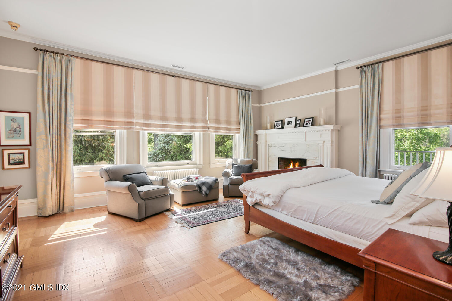 1 North Street Greenwich, CT 06830 - Photo 23 of 36 a bed sitting in a bedroom next to a window