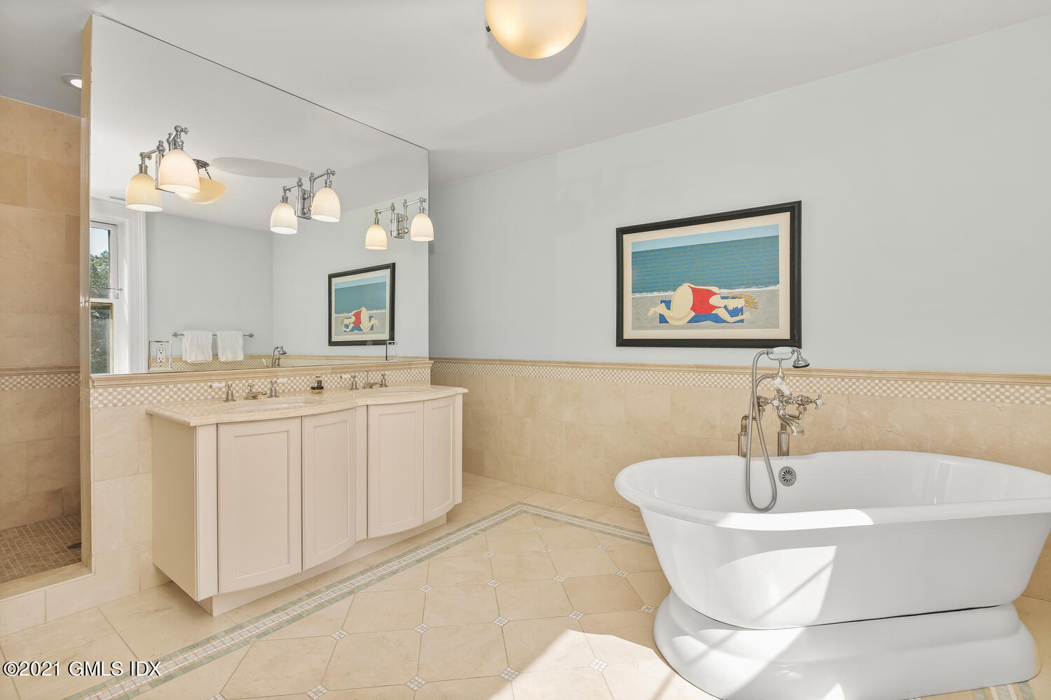 1 North Street Greenwich, CT 06830 - Photo 24 of 36 a bathroom with a sink a mirror and a bathtub