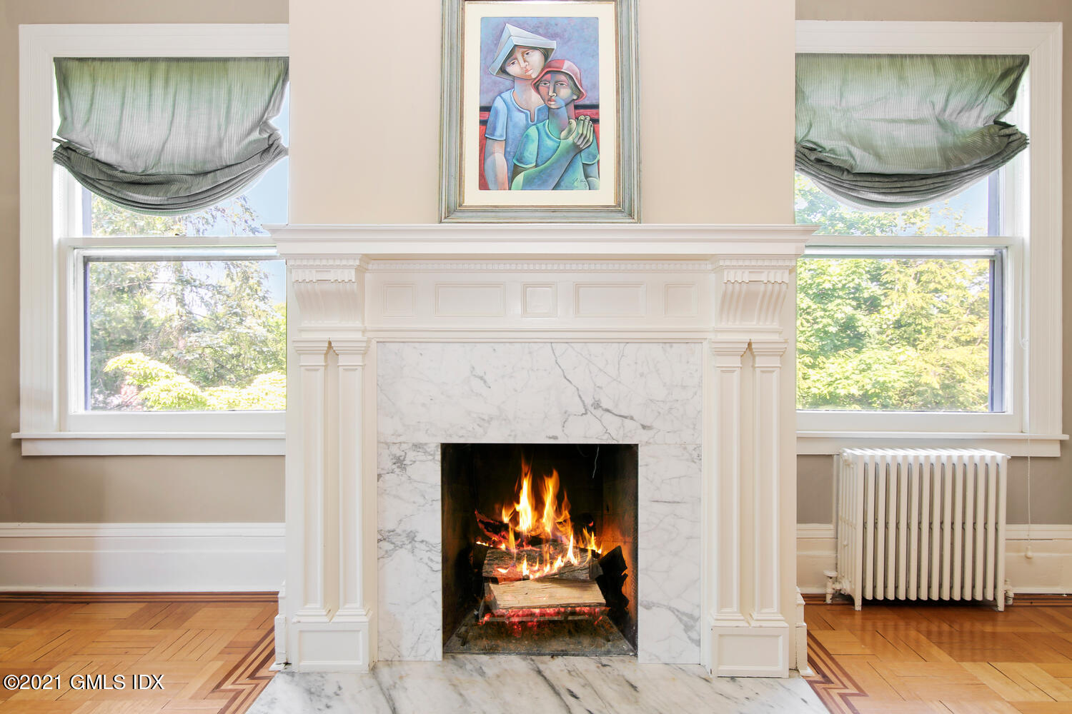1 North Street Greenwich, CT 06830 - Photo 25 of 36 a living room with a fireplace and a window