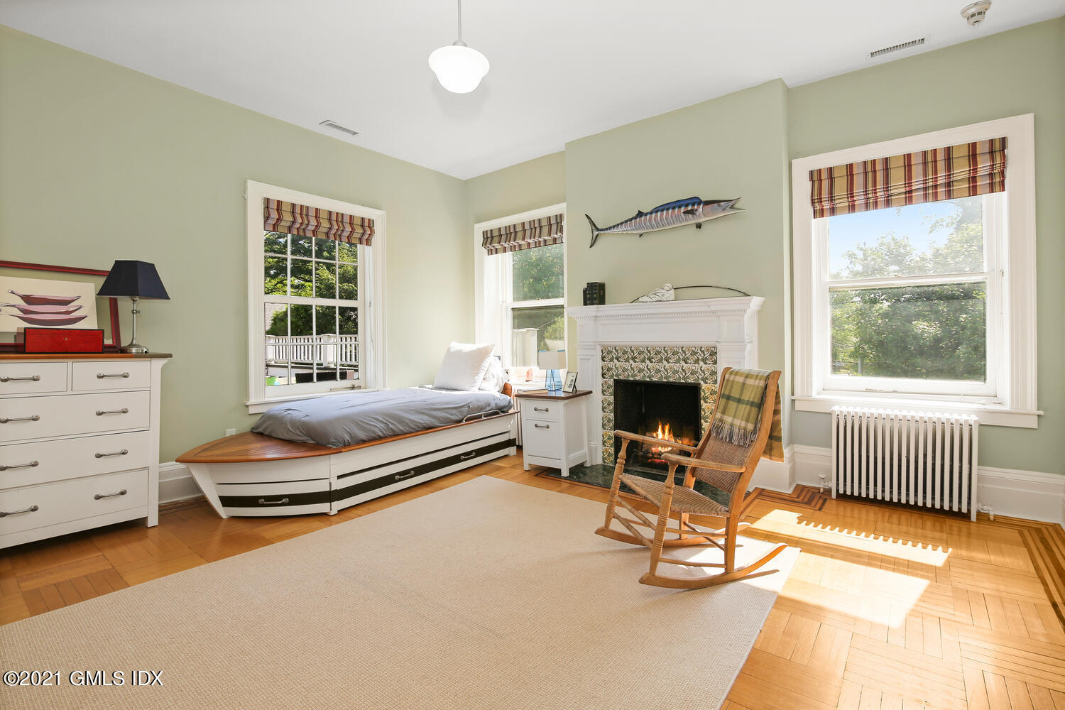 1 North Street Greenwich, CT 06830 - Photo 26 of 36 a living room with furniture gym equipment and a fireplace