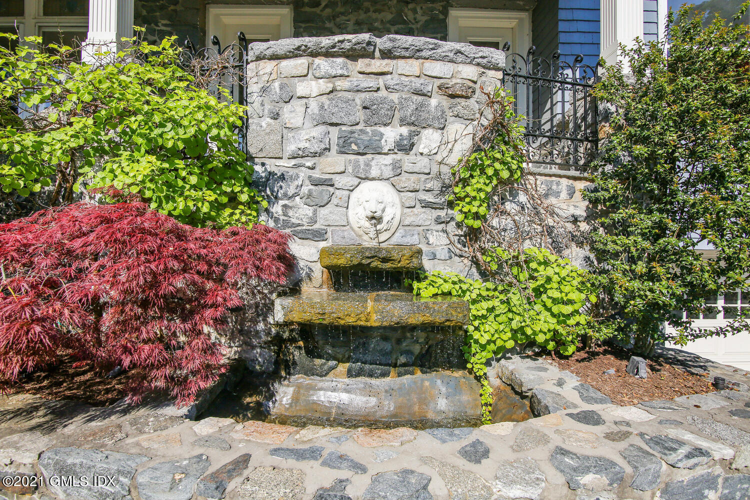 1 North Street Greenwich, CT 06830 - Photo 3 of 36 a view of a backyard with plants