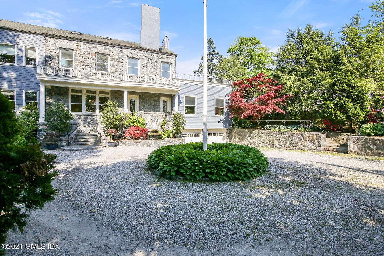 1 North Street Greenwich, CT 06830 - Photo 36 of 36 a front view of a house with garden