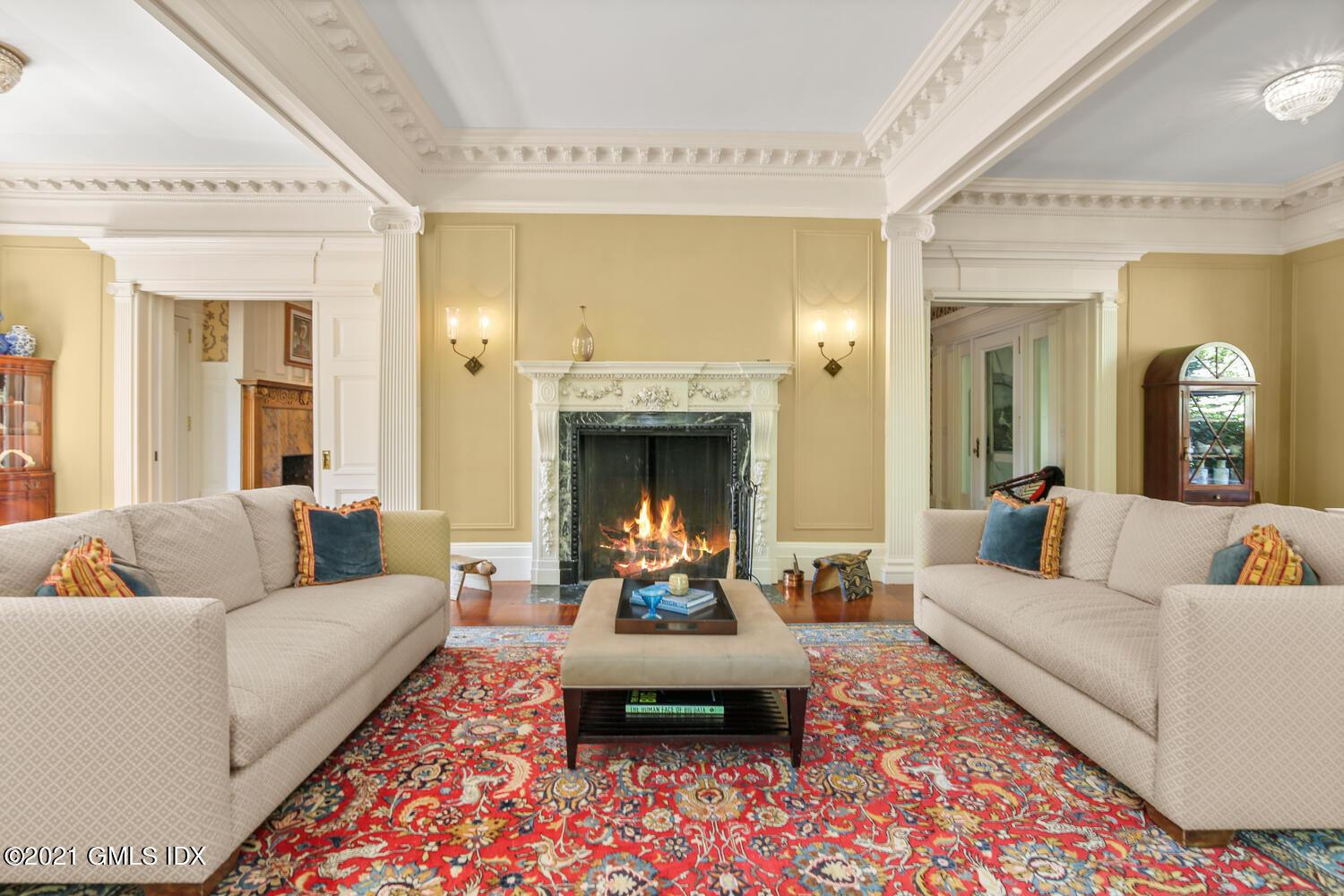 1 North Street Greenwich, CT 06830 - Photo 9 of 36 a living room with furniture and a fireplace