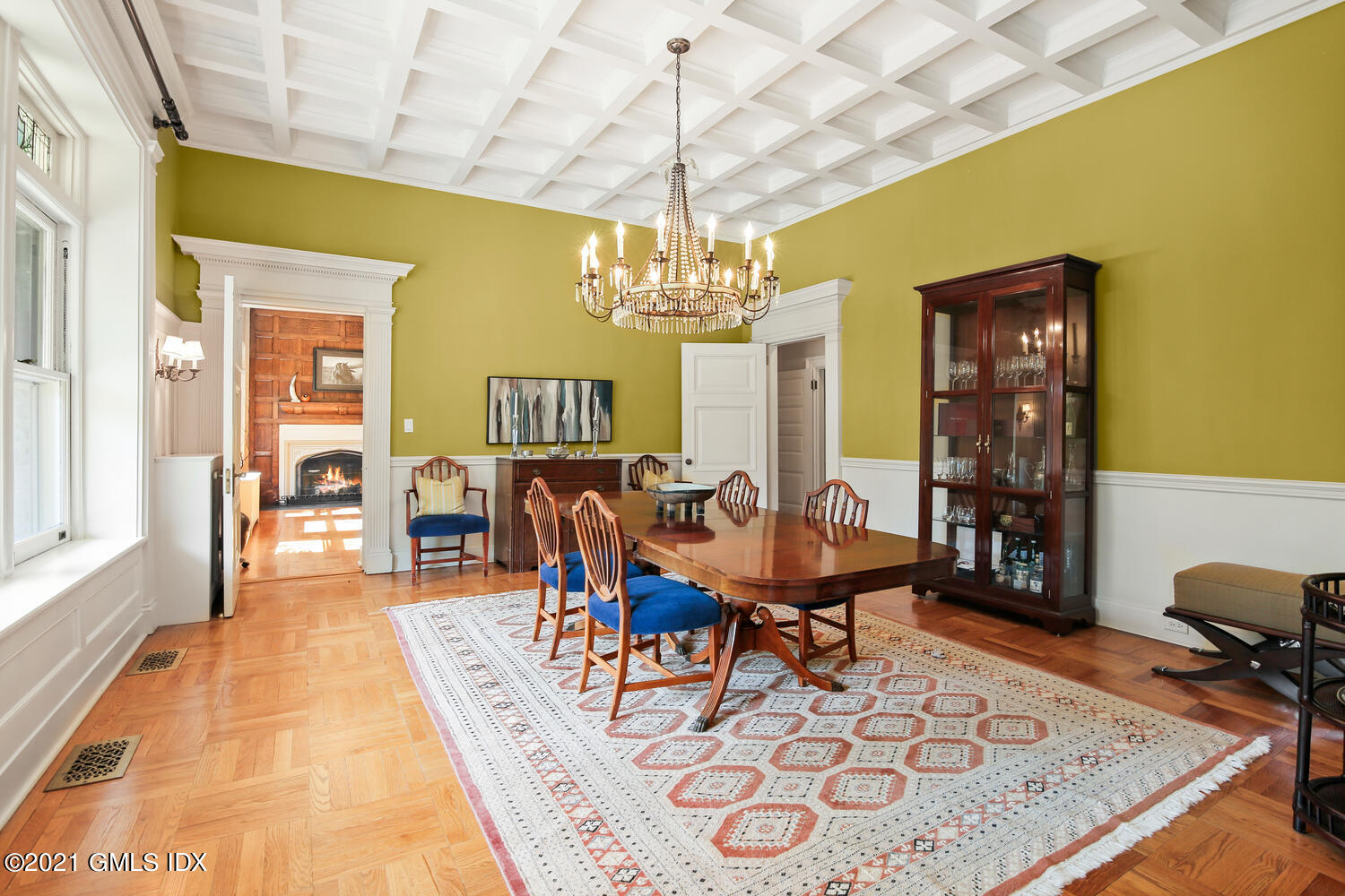 1 North Street Greenwich, CT 06830 - Photo 10 of 36 a dining room with chandelier and wooden floor