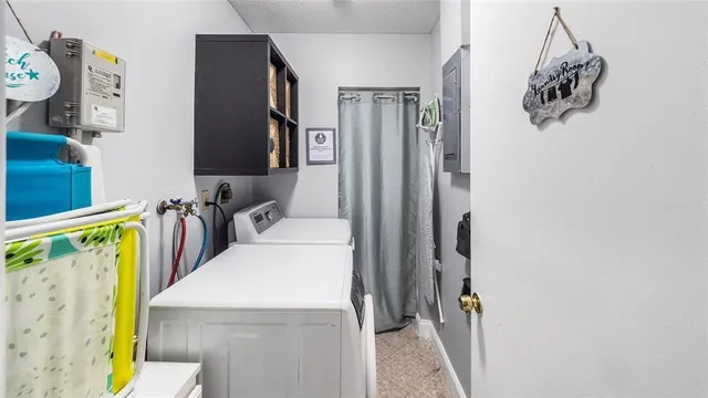 a view of hallway with washer and dryer
