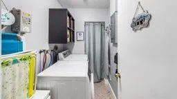 a view of a kitchen from the hallway