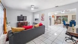 a living room with furniture and flat screen tv