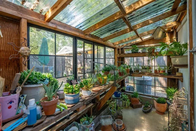 a backyard of a house with barbeque oven