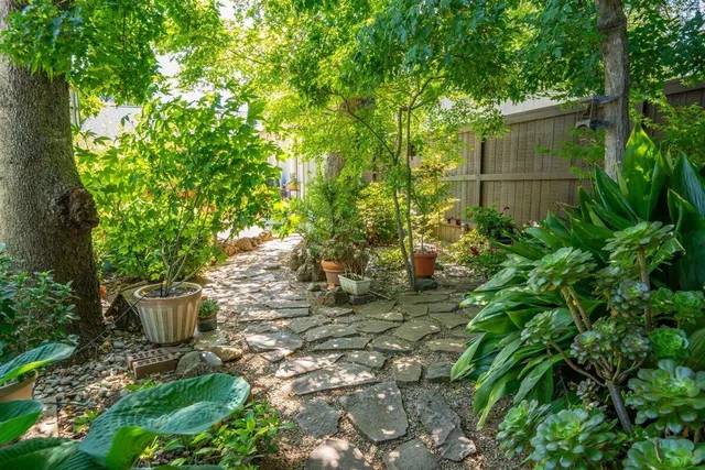 a view of a backyard with sitting area