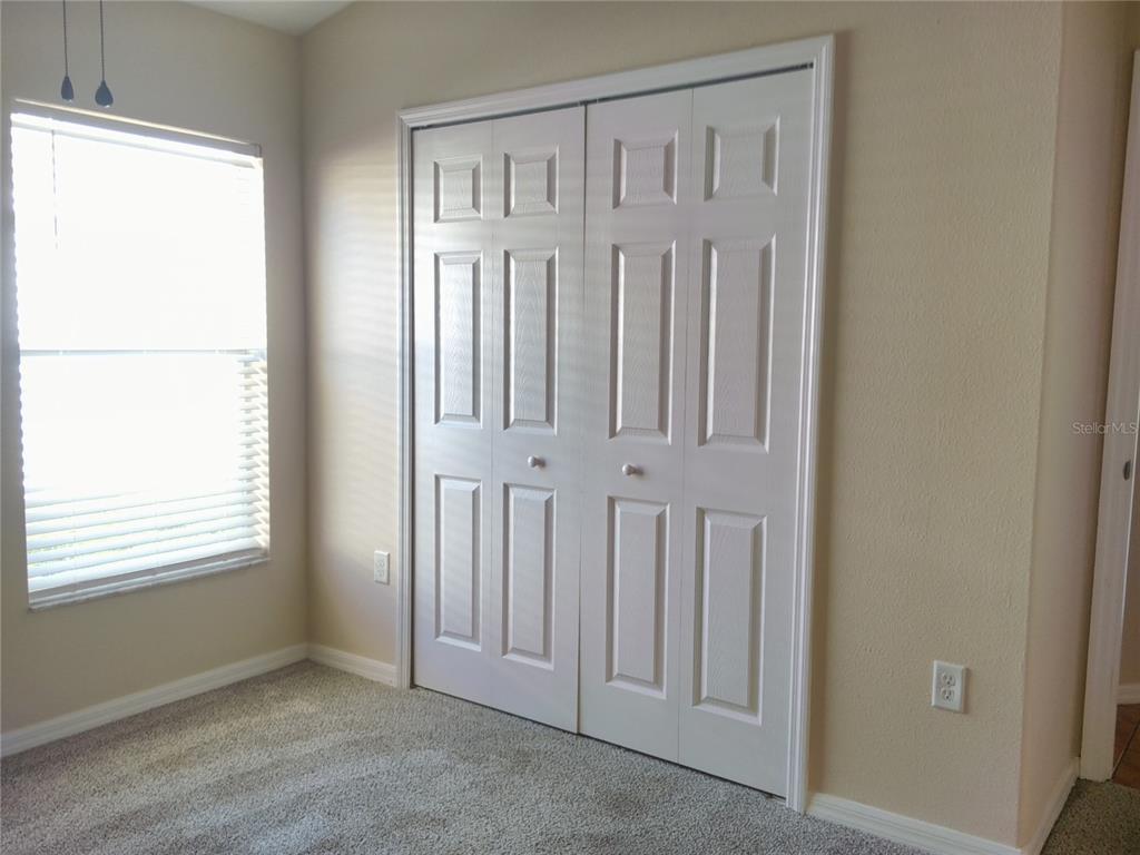 3069 Twinleaf Avenue Deltona, FL 32725 - Photo 20 of 28 an empty room with windows