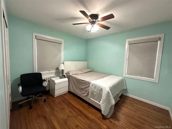 a bedroom with a bed and a chair