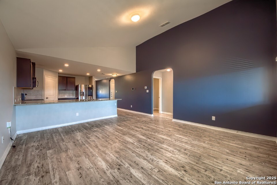 7006 Quantum Loop San Antonio, TX 78252 - Photo 11 of 37 a view of an empty room with a kitchen