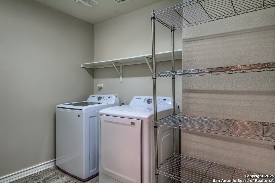 7006 Quantum Loop San Antonio, TX 78252 - Photo 17 of 37 a utility room with dryer and washer