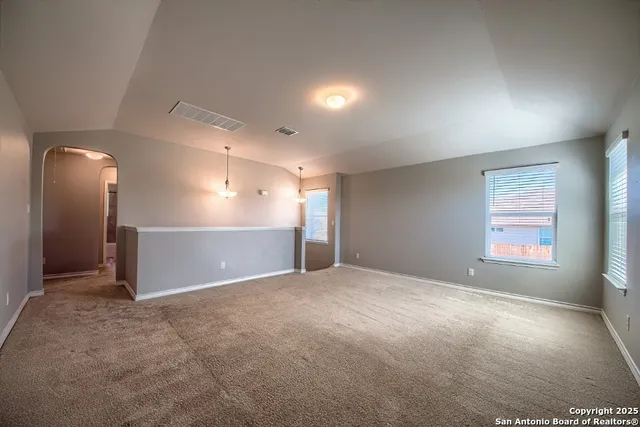 en empty room with windows and closet