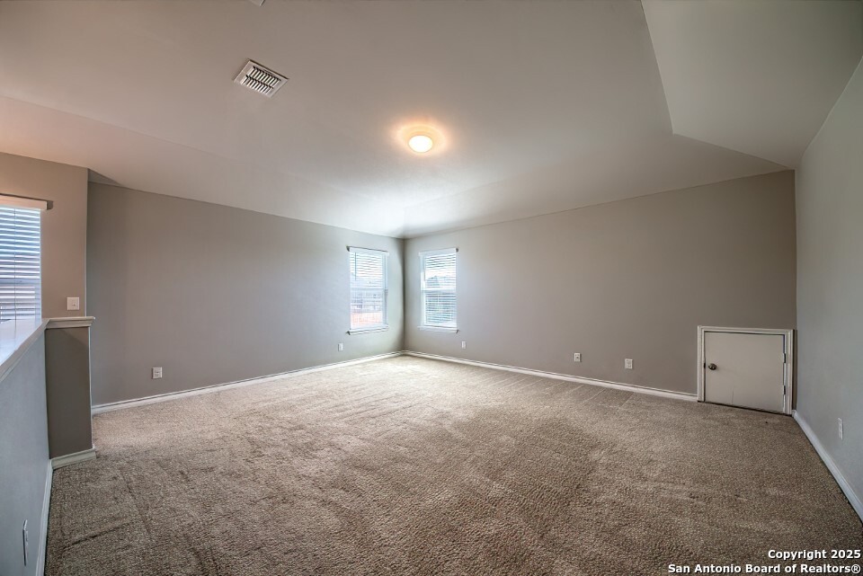 7006 Quantum Loop San Antonio, TX 78252 - Photo 21 of 37 a view of an empty room with a window