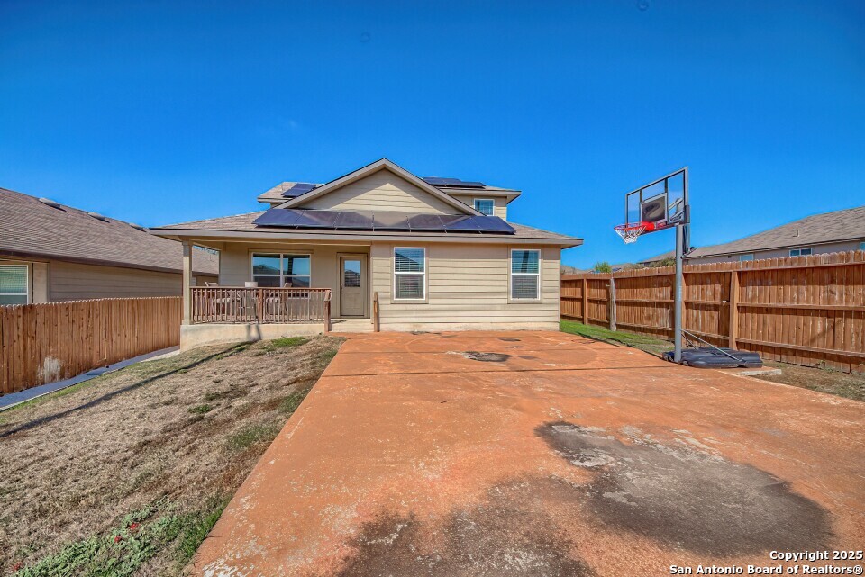 7006 Quantum Loop San Antonio, TX 78252 - Photo 27 of 37 a front view of a house with a yard