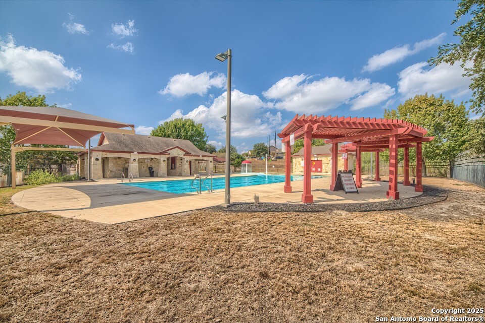 7006 Quantum Loop San Antonio, TX 78252 - Photo 36 of 37 a view of a house with a yard and sitting area