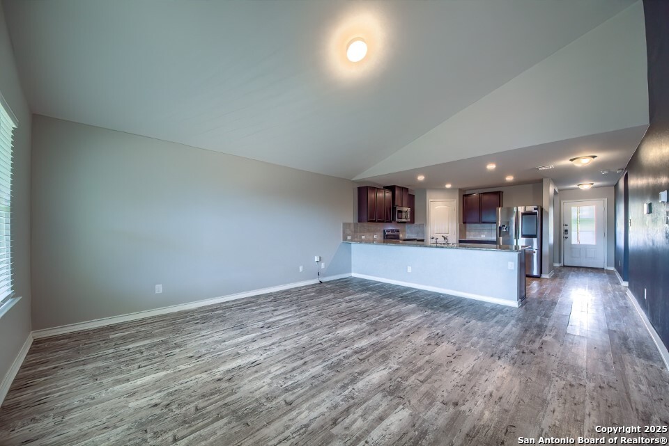 7006 Quantum Loop San Antonio, TX 78252 - Photo 10 of 37 a view of a kitchen with a sink and a window