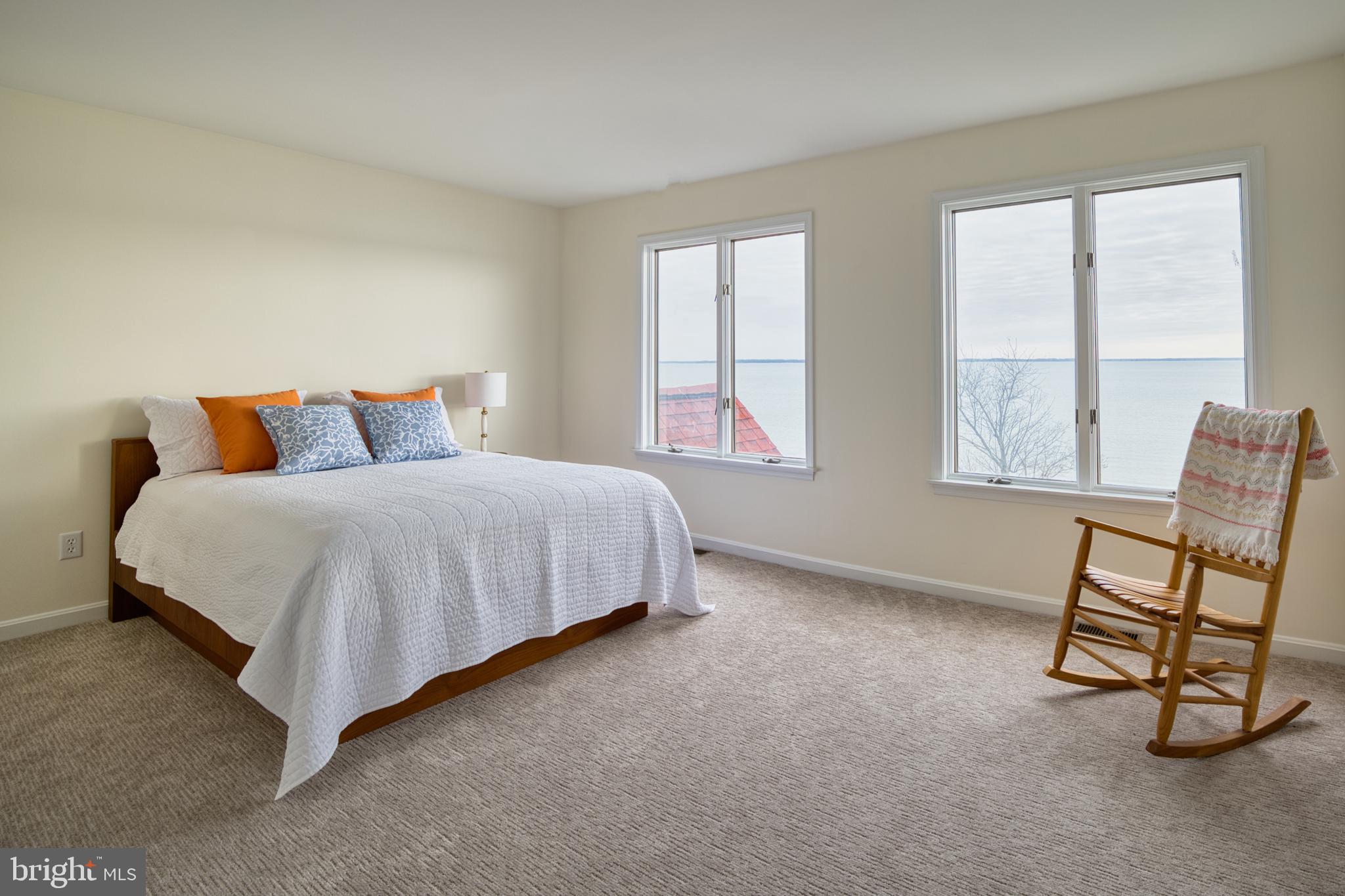 34 Queen Anne Way Chester, MD 21619 - Photo 16 of 52 a bedroom with a bed a chair and next to a window
