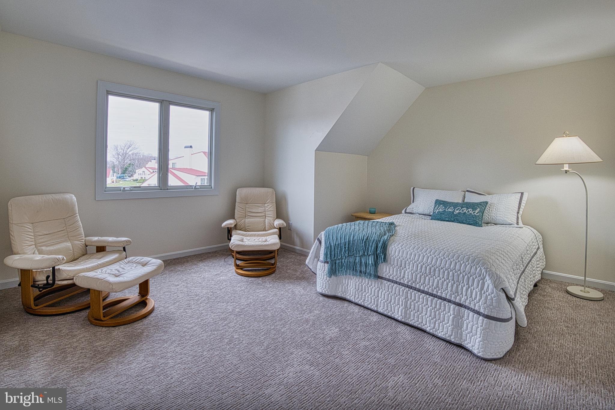 34 Queen Anne Way Chester, MD 21619 - Photo 18 of 52 a bedroom with a bed and a lamp