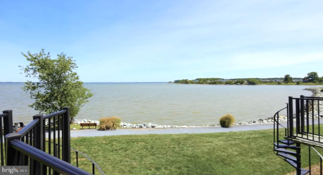 34 Queen Anne Way Chester, MD 21619 - Photo 21 of 52 a view of a lake with table and chairs